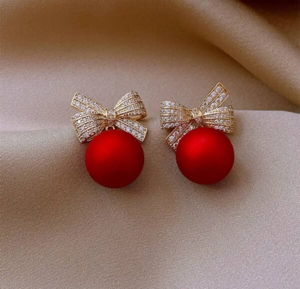 Aretes navideños de moño y esfera